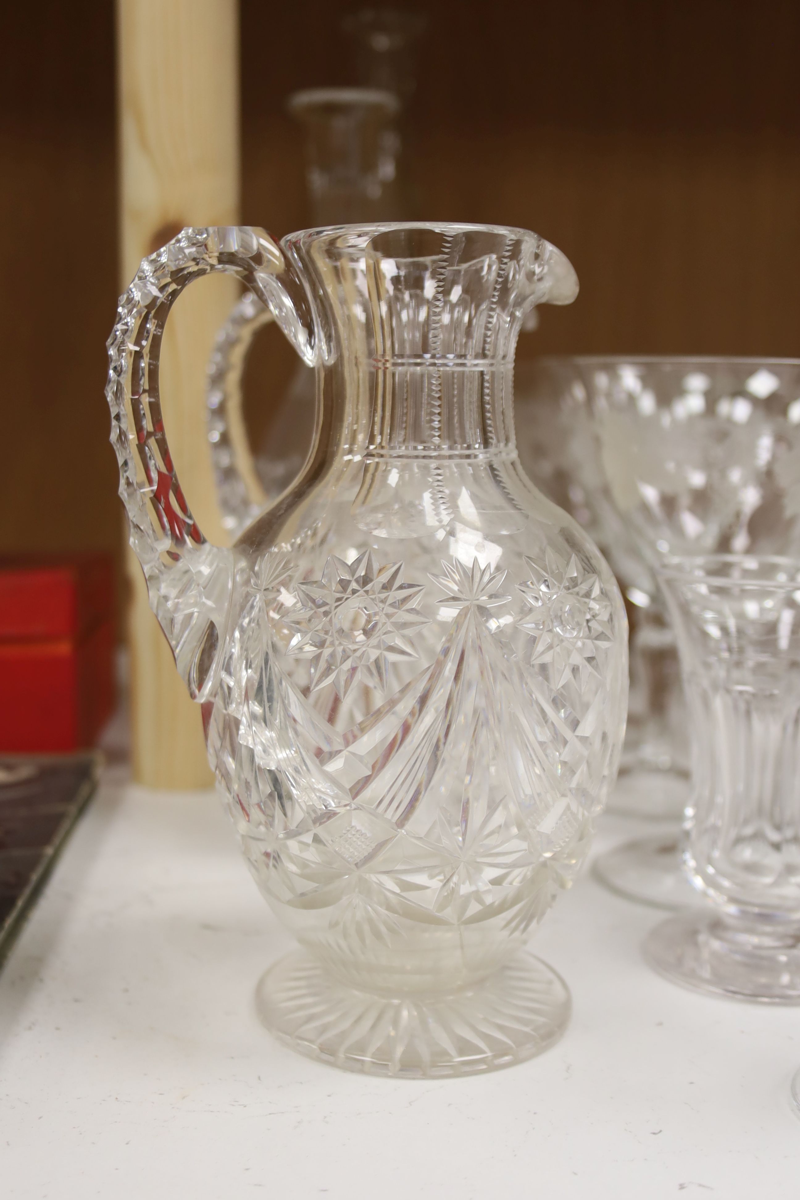 A collection of assorted mixed cut and etched glassware